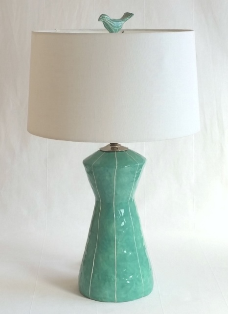 Bird finial, jade scraffito on Space Needle lamp Bird finial, jade scraffito on Space Needle lamp
