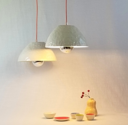 2pendant light hang above small dishes