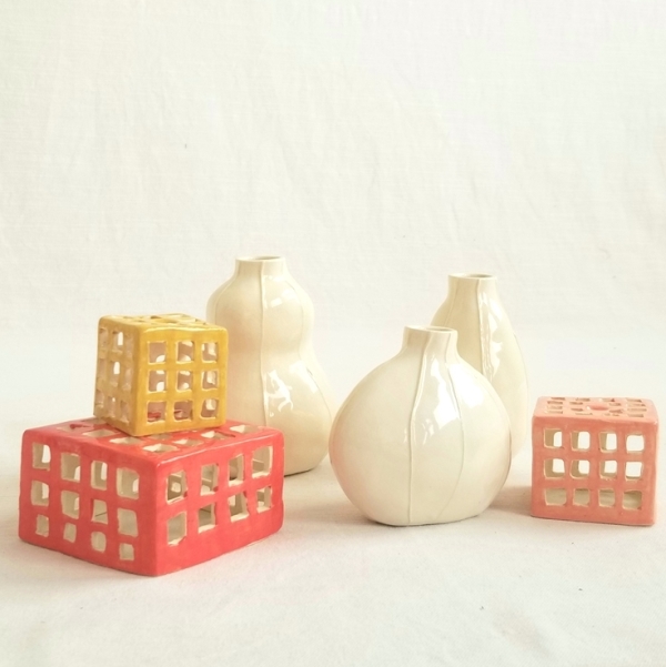 small ceramic box sculptures and white bud vases